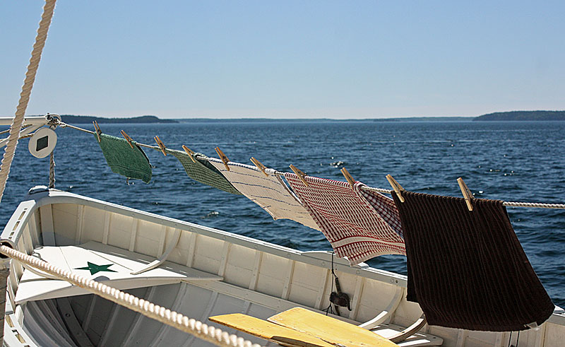 The best way to dry a schooner’s dish towels. (Photo by Holly S. Edwards)