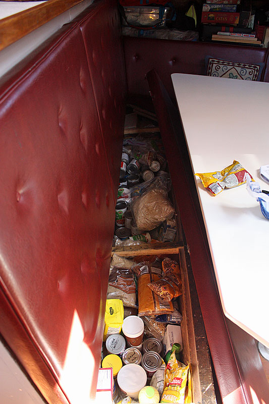 Food storage under the bench seats in the main saloon. (Photo by Holly S. Edwards)