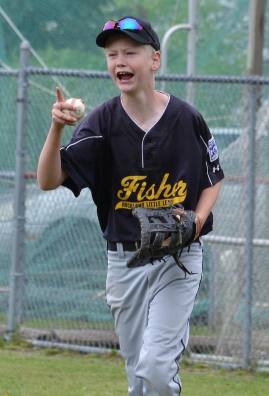 Fisher’s Carson Murphy reacts after getting the out at first base. (Photo by George Harvey)