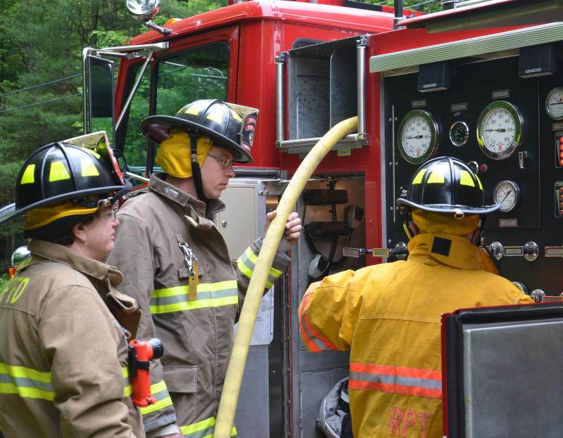 Rockport firefighters man the water: Charlie Pearson, Justin Ford and Bruce Woodward. (Photo by Lynda Clancy)