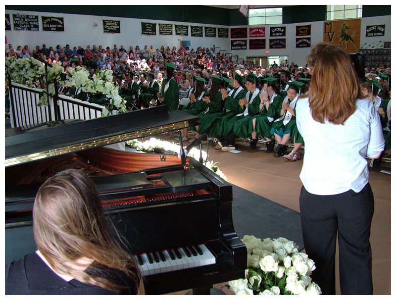 The view of assembled graduates, relatives and friends from stage right. Pianist Kayla Anderson, foreground, provided the processional and recessional music.