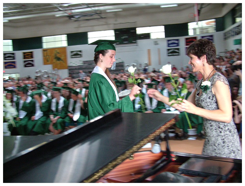 Students were given white roses along with their diplomas and asked to give them to someone special. Many ended up in the hands of relatives.