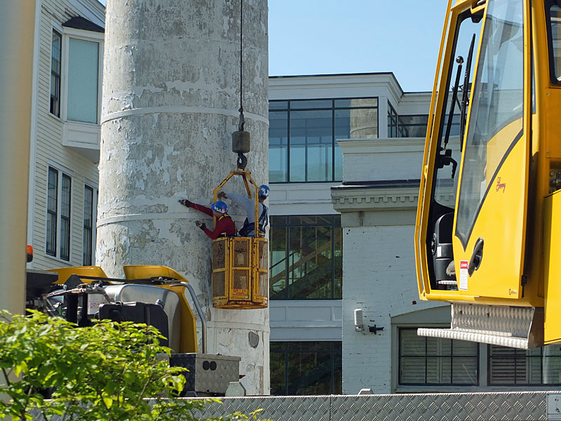 Inspectors check out the Knox Mill smokestack Tuesday morning in downtown Camden. (Photo by Chris Wolf)