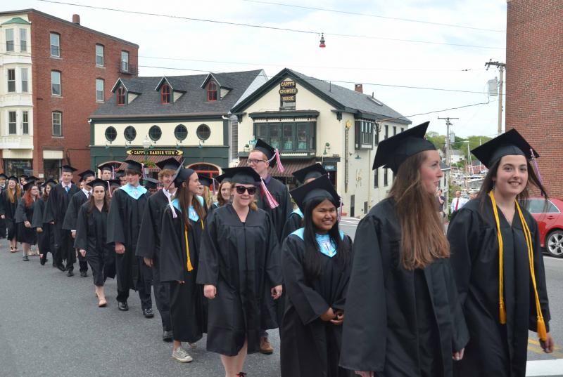 The Camden Hills Regional High School Class of 2014 marches through Camden’s downtown on the way to the First Congregational Church for the annual baccalaureate. (Photo by Lynda Clancy)
