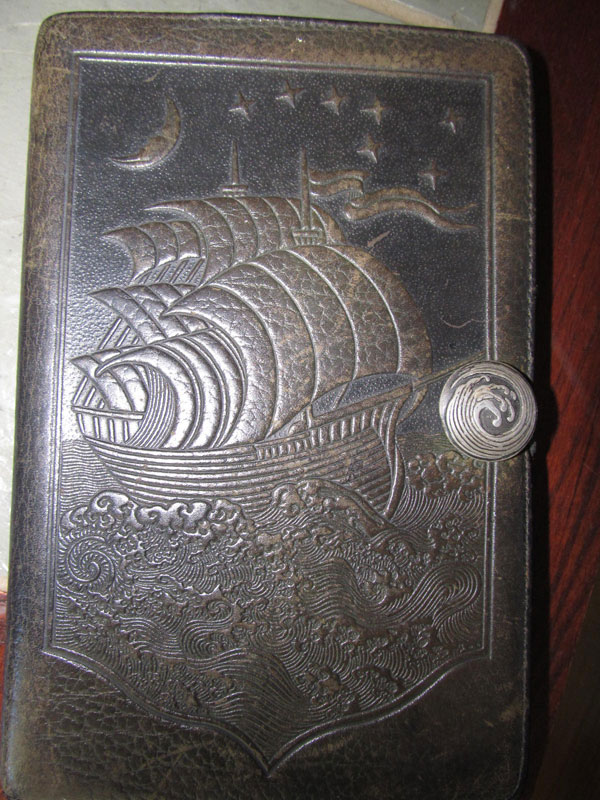 The old leather journal where Pirate John writes most of his poetry and observations. (Photo by Kay Stephens)