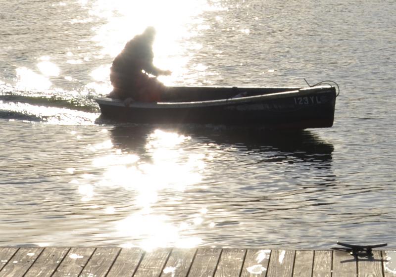 Skiffs ply the harbors until the ice skims the water. (Photo by Lynda Clancy)