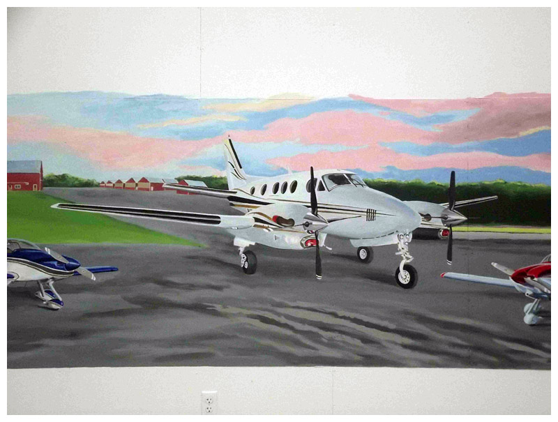 The airplane belonging to Michael Sobota, who commissioned the mural inside his hangar at Belfast Municipal Airport. (Photo courtesy of David Hurley)