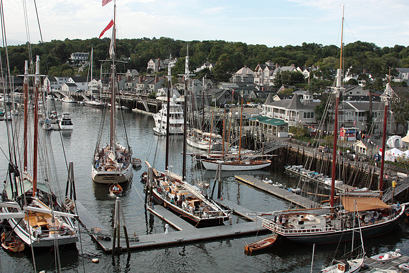 The schooner Heritage is pushed out of its overnight berth at the Camden town dock by its yawl boat, or tender, Saturday morning. (Photo by Holly S. Edwards)