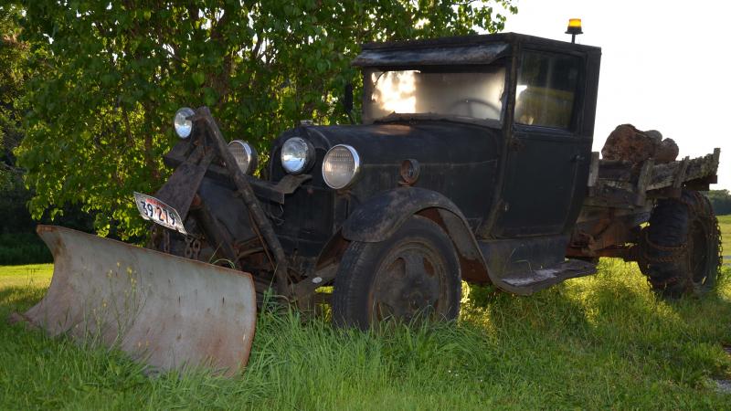 The plows get hooked to trucks in the fall, and the logs hauled in from the woods. This old truck lives in Warren. (Photo by Lynda Clancy)