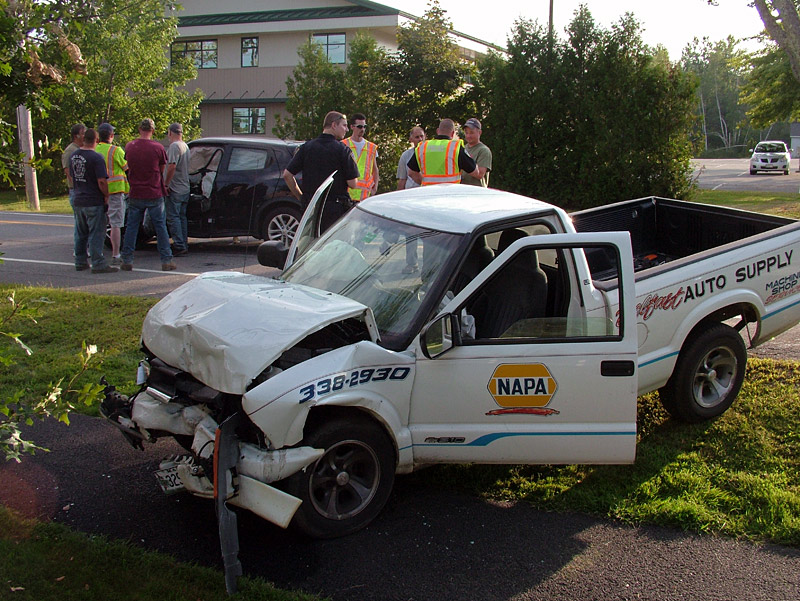A pickup and an SUV, background, that collided on Northport Avenue Wednesday afternoon. The crash followed an earlier three-car pile-up across town on Swan Lake Avenue. (Photo by Ethan Andrews)