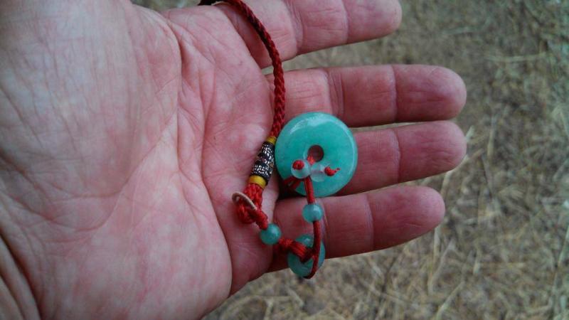 “The note began with these words, ‘I don't know you very well’ an explanation of the origins of the pendant followed, with good wishes for an easier time.” The pendant symbolizes good karma. (Photo courtesy Cheryl Denz)
