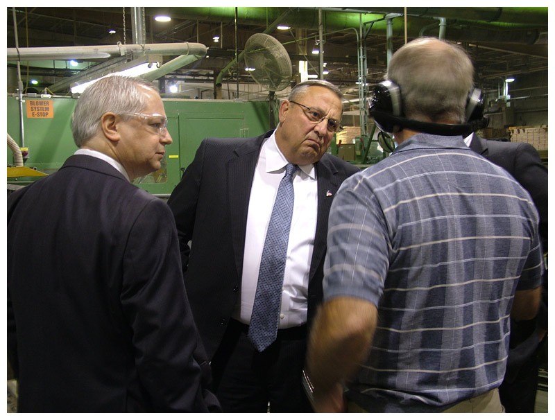 Gov. Paul LePage talks with Pride Sports executives inside the company’s Burnham manufacturing plant, Sept. 17. (Photo by Ethan Andrews)