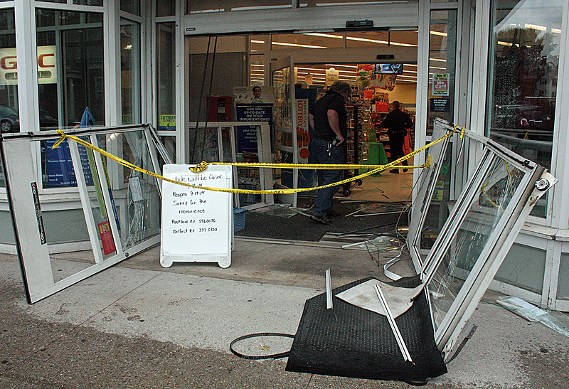Maine State Police used a battering ram to gain entrance into the Camden Rite Aid around 3 a.m. today after 34-year-old Robert Beerman of Camden entered the store Monday evening with a shotgun, told customers and staff to leave, barricaded himself in and held a pharmacist hostage for more than three hours. Today, the hostage is safe, Rite Aid is cleaning up and making repairs, and police are trying to determine a motive behind Beerman’s decisions, that resulted in his death. (Photo by Holly S. Edwards)