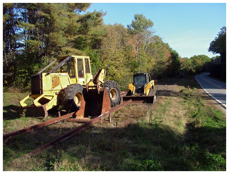 Tractors parked along Upper High Street on Friday after removing a section of railroad tracks between the Upper Bridge crossing and City Point Central Station. (Photo by Ethan Andrews)