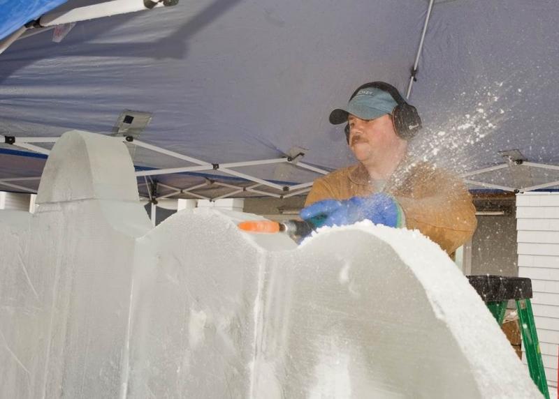 Chef and ice carver Tim Pierce works on the raw 50-pound ice blocks. (Photo courtesy Richard Barnett)