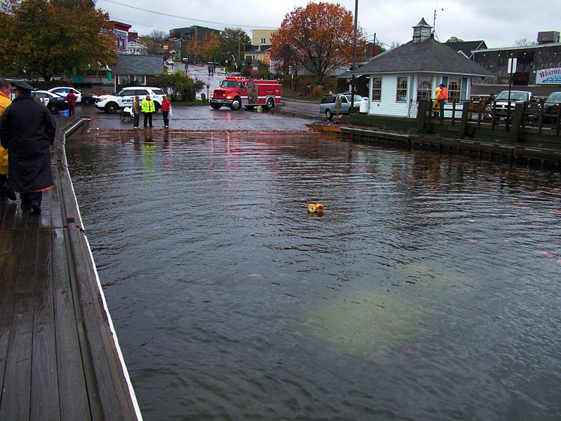 A submerged car is visible at the public boat launch in Belfast Thursday morning. The driver, Eva Lenfest of Searsport, was rescued from the car thanks to the quick action of two local workers. (Photo by Ethan Andrews)