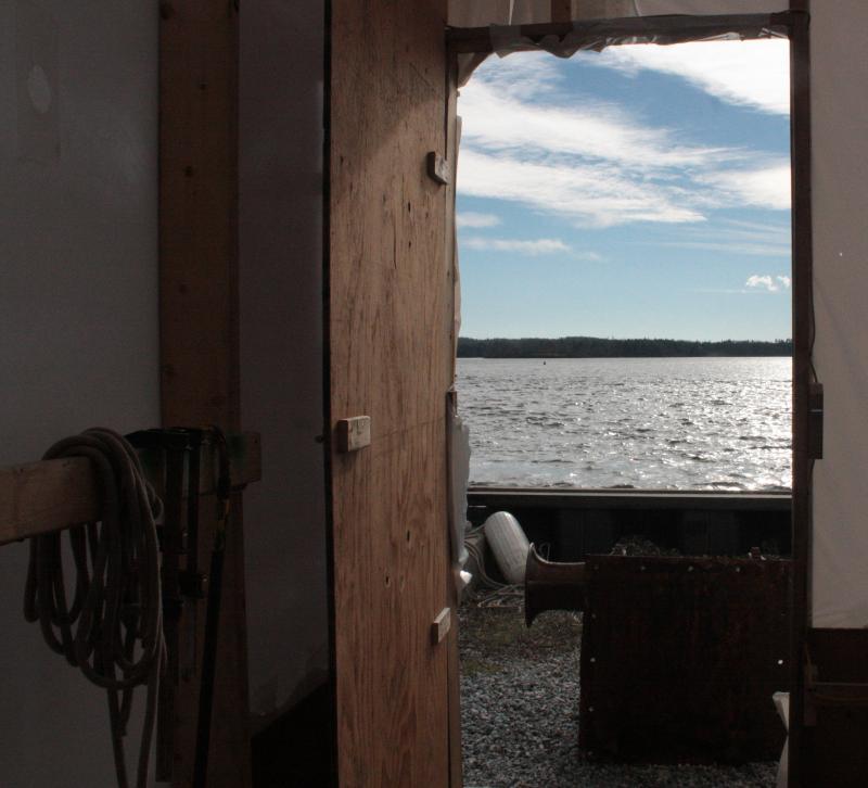 The view out the back door of the temporary building at Lyman Morse Boatbuilders, where the ‘Nathaniel Bowditch’ will spend the winter. (Photo by Holly S. Edwards)