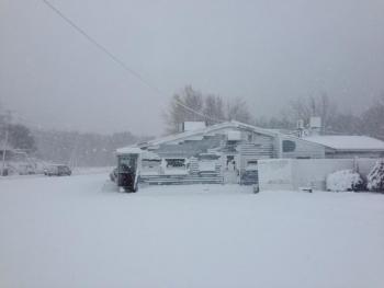 A homeowner’s yard blanked with snow.