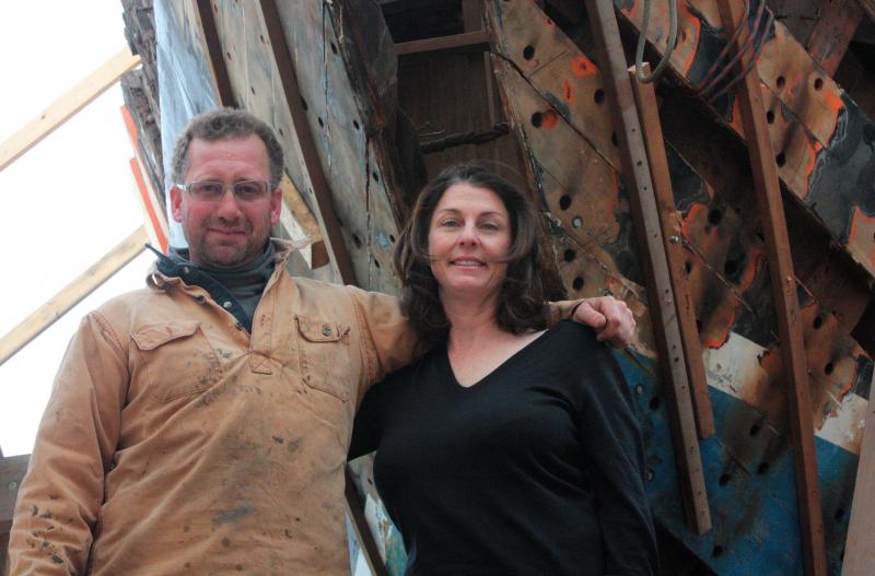 Noah and Jane Barnes, owners and operators of the schooner ‘Stephen Taber,’ now also own the schooner ‘Nathaniel Bowditch’ and are rebuilding it inside a wood-heated temporary building at Lyman Morse Boatbuilders on the Thomaston waterfront. (Photo by Holly S. Edwards)