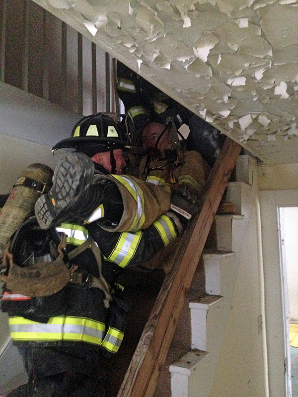 The RIT training held in Searsmont last week included practicing how to remove immobile or injured firefighters from the building. (Courtesy Jason Peasley)