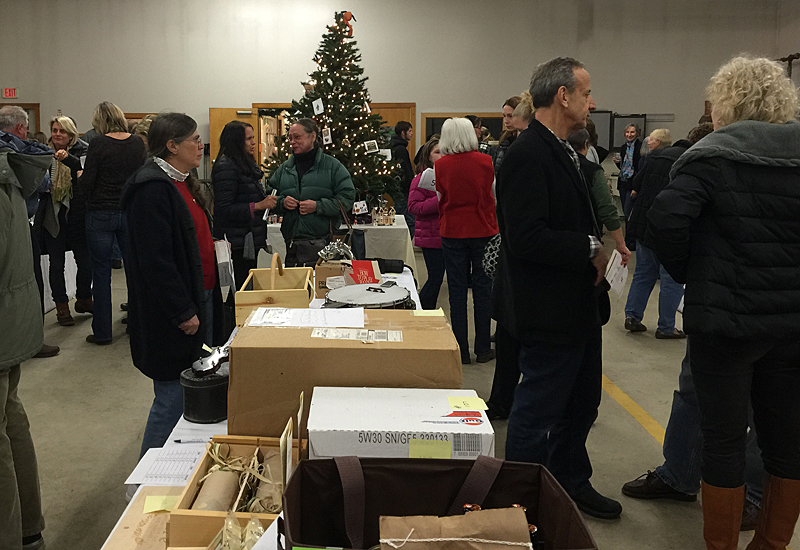 Lots of great donated items to bid on to benefit P.A.W.S. Animal Adoption Center. (Photo by Holly S. Edwards)