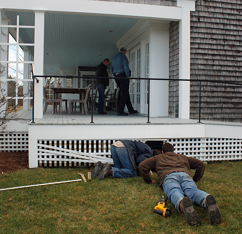 The deck under which the fox and Lucy ended up, and where Evan Drinkwater discovered them in an old foundation hole. Two rows of lattice blocked the cement foundation wall, over which only a small dog and a fox could breach with the deck still in place above. (Photo by Holly S. Edwards)