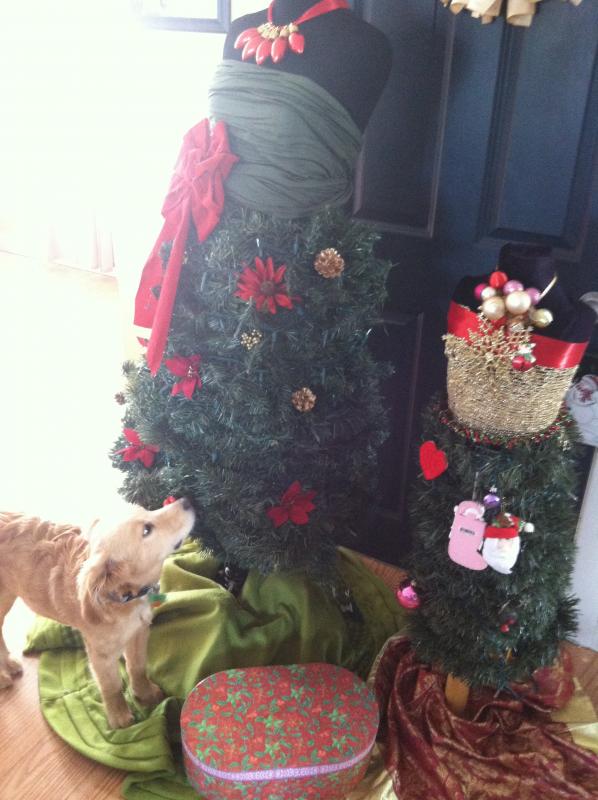 Puppy Simon is curious, but so far hasn’t tackled the mannequin Christmas tree. (Photo by Mandie Goody Sawyer)