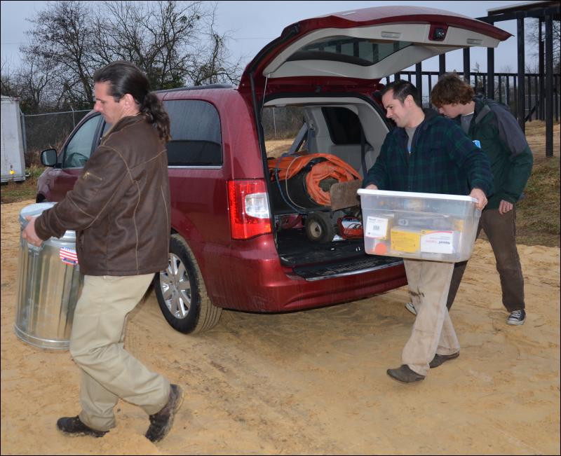 Ben Hutchinson, Andrew Stewart and Henry Laurita unload the van that transported therapeutical equipment and treatment to Oklahoma. (Photo by Lynda Clancy) hope elephants (1499)
