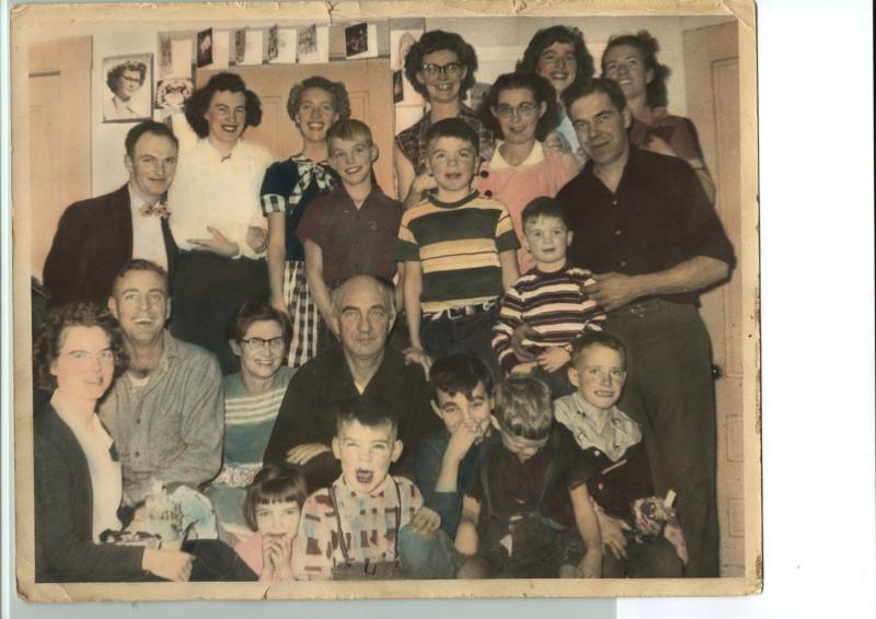 Russ and Jennie Carver surrounded by their children, their spouses and the grandchildren on a Christmas Day about 1950. See the cards taped around the door frame. Front row:Doris (Carver) Delano, Laurel (Rokes) Williams, John Delano, Phillip Tibbetts, Jack Carver, Norman Carver Jr. 2nd row:Norman (Pete) Carver Sr., Jennie (Hardy) Carver, James Russell Carver Sr.,Thomas Rokes 3rd row: Samuel Tibbetts Jr., Sanford R. Delano, Hope (Carver) Tibbetts, Sanford F. “Buster” Delano Back row: James Russell Carver Jr., Barbara (Barrett) Carver, Edith (Carver) Gallimore, Winnifred (Carver) Rokes/Marriner, Patricia (Tibbetts) Richardson, Eileen (Bishop) Carver. (Photo courtesy of Sandy Delano) carver farm christmas