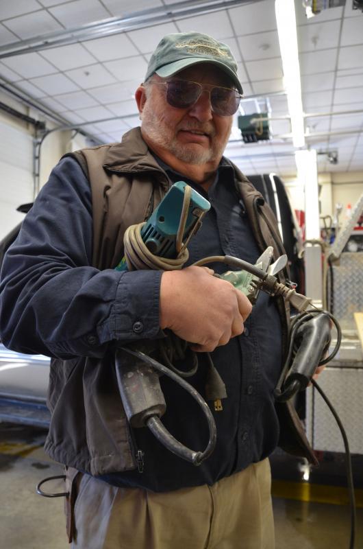 Rockport firefighter Allen Mitchell, who also owns a construction company, comes to the station loaded for bear. (Photo by Lynda Clancy)