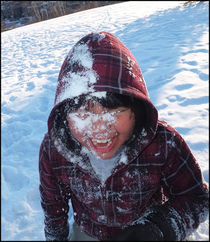 A.J Defazio, 9, is from Guatemala. He demonstrates the “snowplow” technique of eating snow.