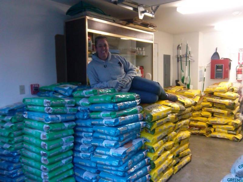 Heidi Neal, with the donated pet food. (Photo courtesy Pope Memorial Humane Society)