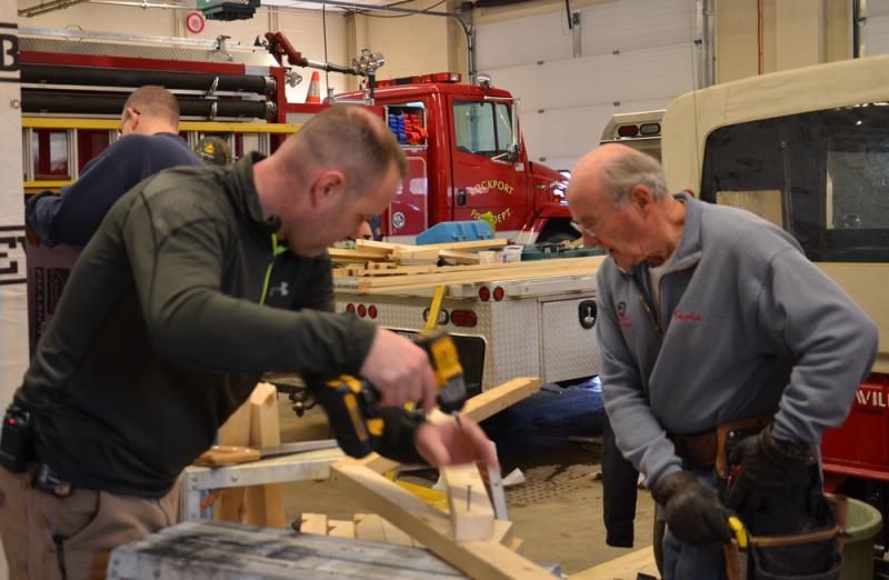 Rockport Fire Chief Jason Peasley and Firefighter Charlie Knight get to work. (Photo by Lynda Clancy)