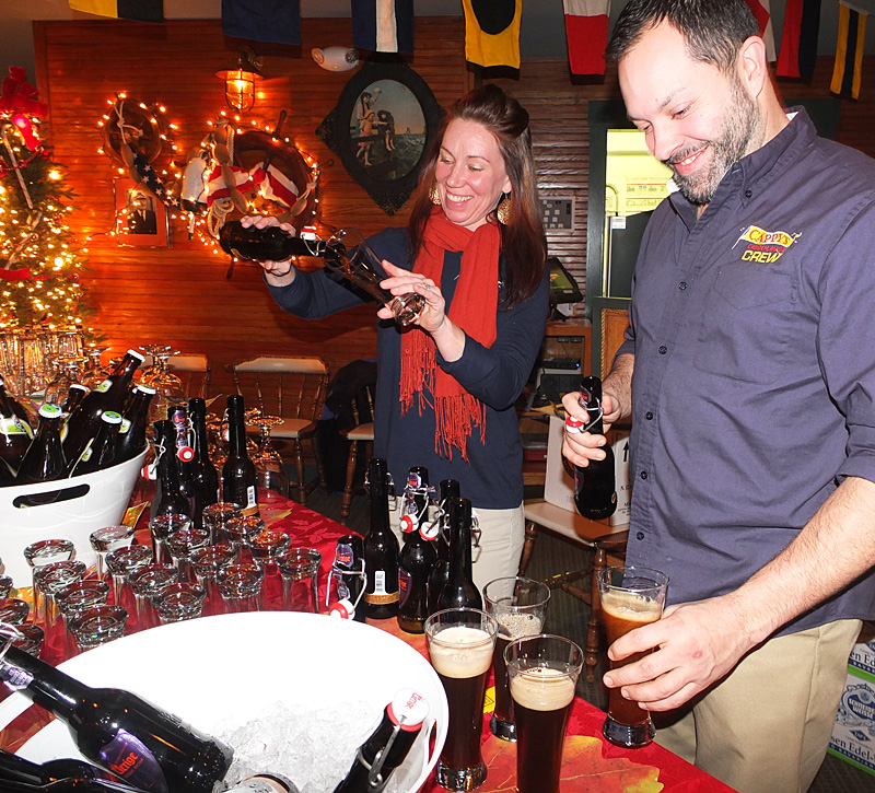 Colleen Wellman, left, and R.J. Godbout pour a beer to go with one of the food courses offered.