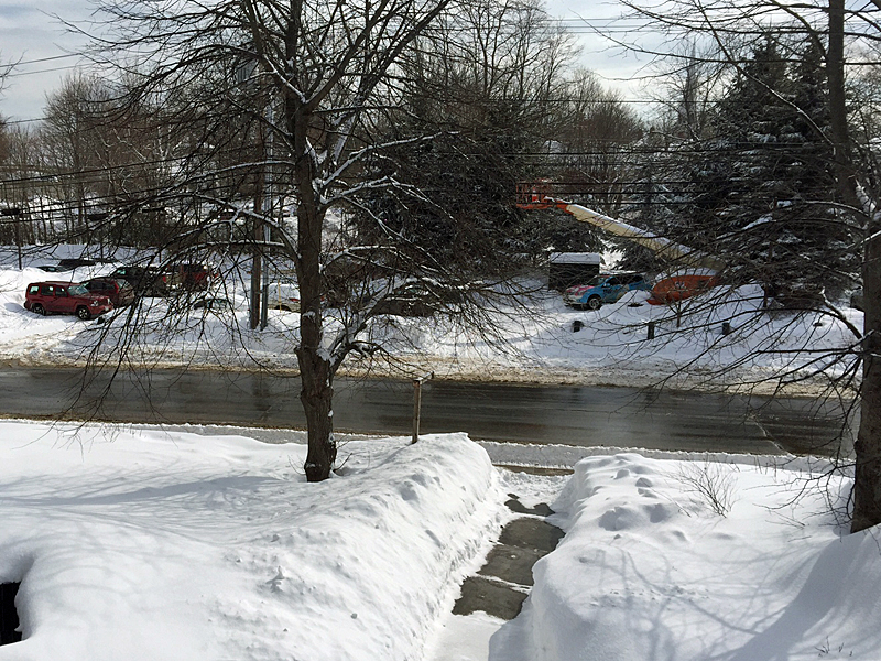 It’s amazing how a little warmer temperatures and some sunshine can finally melt the last layers of snow off the roads downtown. At 1:35 p.m., the temperature is 30 F. (Photo by Holly S. Edwards)