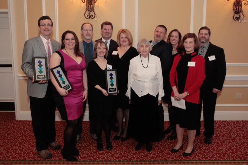 Chamber Awards Winners (L-R): Rick Bresnahan from Pitch; Devon Salisbury from "Pop For Change;" Ken Gross and Jennifer Temple from Camden Winterfest; President of the PBRCC Board, Mike Hall; PBRCC Executive Director Staci Coomer; Leona Pierpont, Community Volunteer of the Year; Frank Isganitis, Chamber Community Person of the Year; Heidi Neal from Loyal Biscuit; Judy O'Dell from Maine Media Workshops + College; and Joel Neal Jr. from Loyal Biscuit. issing: athenahealth, Economic Enhancement winner and Hope Elephants, Special Recognition award winner.