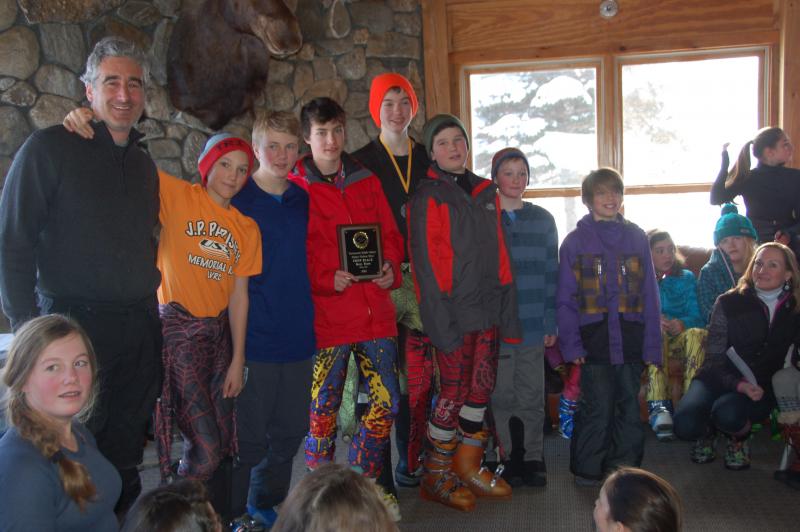 The Camden Snow Bowl middle school boys team at a Jan. 31 race. From left are Coach Weber Roberts, Ethan Andrus, Cedar Andrus, Simon Fedarko, Michael Frampton, Caellen Roberts, Devon Smith and Noah Lachance. (Courtesy Lisbeth Whitney)