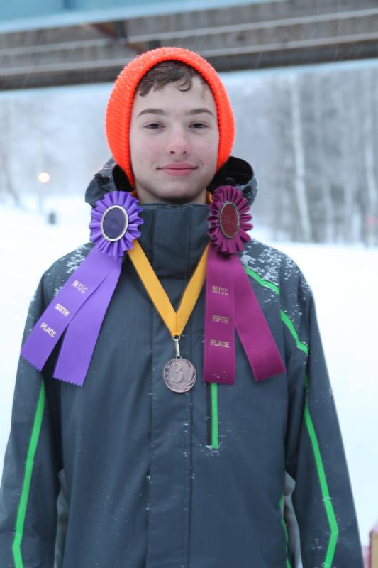 Michael Frampton and his awards for slalom (third), giant slalom (sixth) and ski meister (fifth). (Courtesy Lori Traikos)