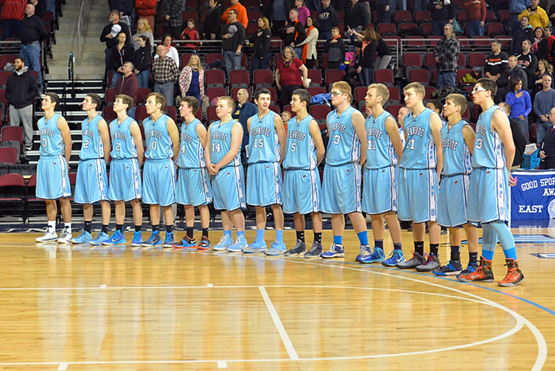 The Oceanside boys stand for the National Anthem before their game Saturday morning in Bangor. The Mariners fell to No. 2 Winslow 46-40. (Photo by Ron Hawkes)
