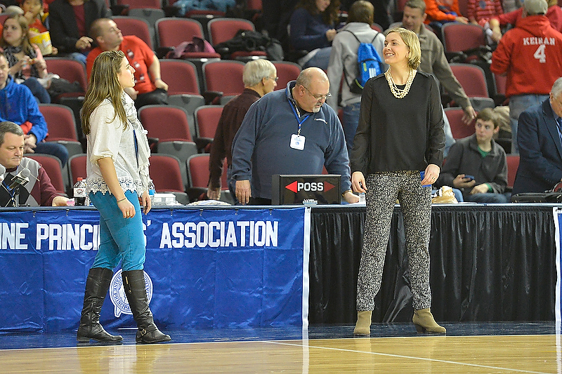 Two outstanding alumni players from Camden Hills, now coaching rival teams, Meg Cressler, right at Camden Hills and Samantha Wiley, at Oceanside share a laugh before the game. (Photo by Ron Hawkes)