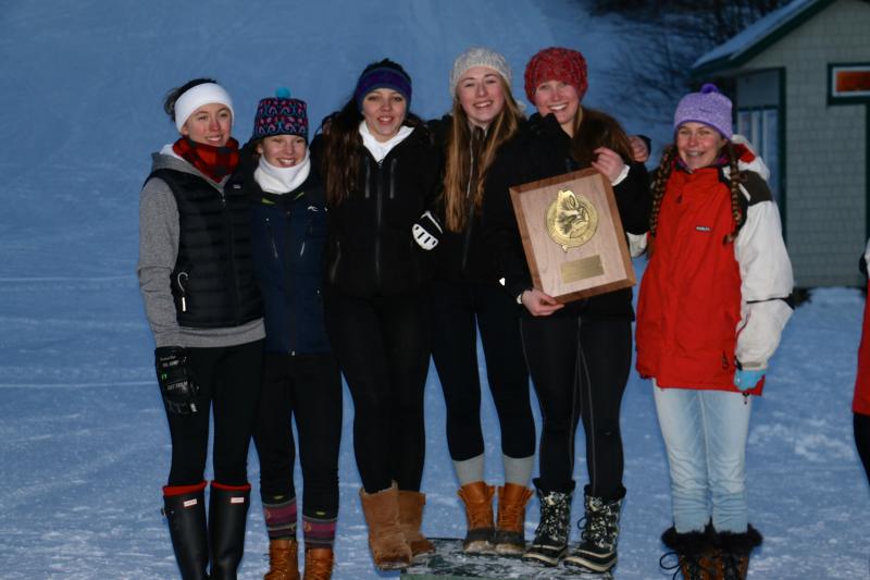 Several Camden Hills girls alpine skiers hold up the Class B girls runner up plaque. Pictured, from left, are Audrey Heriz-Smith, Samantha Zwecker, Molly Mann, Brynne Wrona, Renaissance Lyman and Katherine Dailey. Not pictured are Lydia Morin, Ella Simon, Raine Ellison and Abby Chamberlin. (Courtesy David Lyman)
