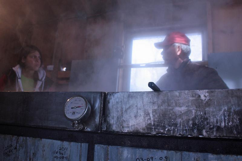 When the sap in the extractor reaches 220 degrees Fahrenheit in the final trough, it’s considered maple syrup and will be drawn off and bottled. (Photo by Holly S. Edwards)