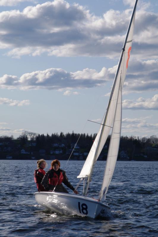 High school sailors race 420s. Once familiar with optimists, summer sailors are also taught in 420s. (Photo by Erica Crane)