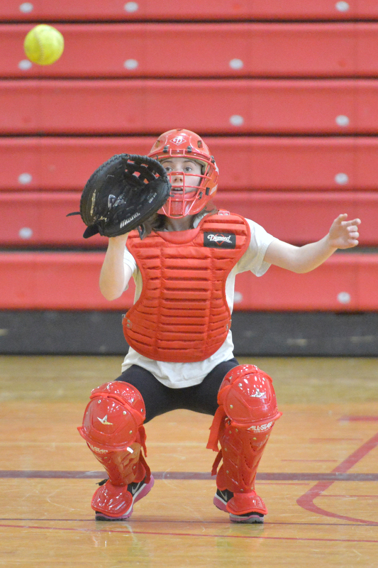 Camden Hills’ Nicole Brown catches during Thursday’s pitching drills. (Photo by Ron Hawkes)