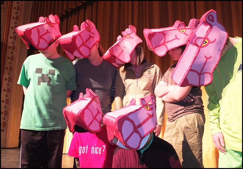 Pink Panthers act as stage crew.