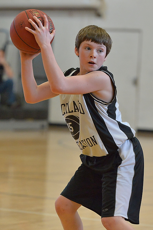 Rockland’s Hunter Norton pulls down a rebound and looks for the outlet. (Photo by Ron Hawkes)