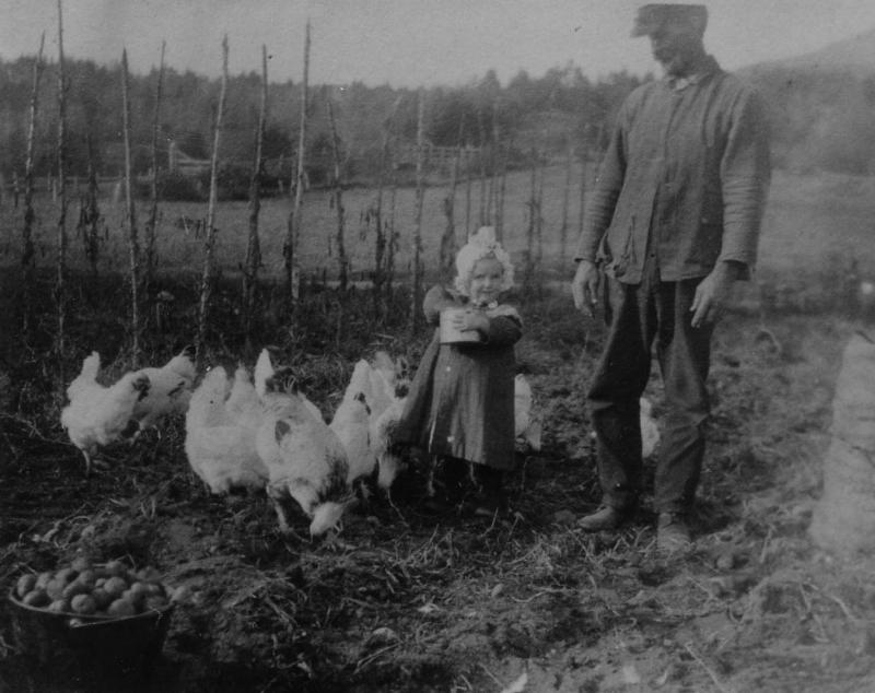 Austin’s cousin Osborne Wade feeding the chickens with his little daughter.
Photo by Austin Wade feeding the chickens