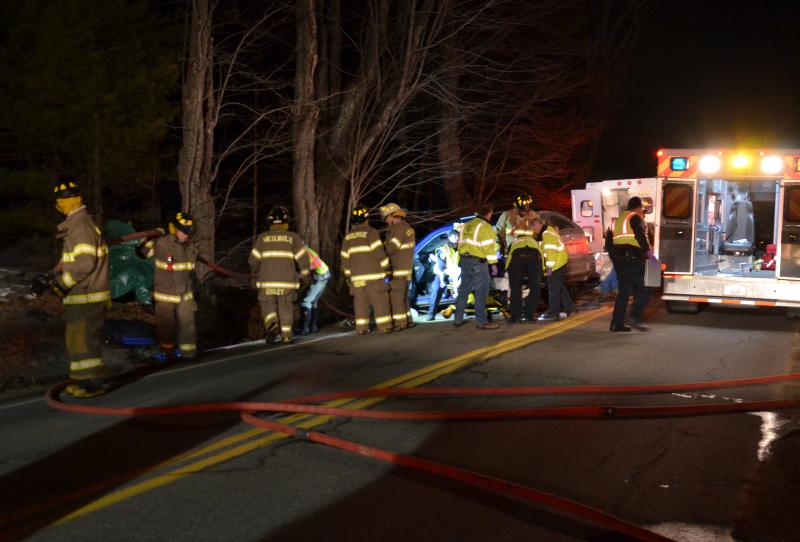 First responders work to extricate Priscilla Jones from her car following an accident on Route 52 in Lincolnville Tuesday night, March 31. According to Waldo County Sheriff’s Office, she suffered non-life-threatening injuries. (Photo by Lynda Clancy)