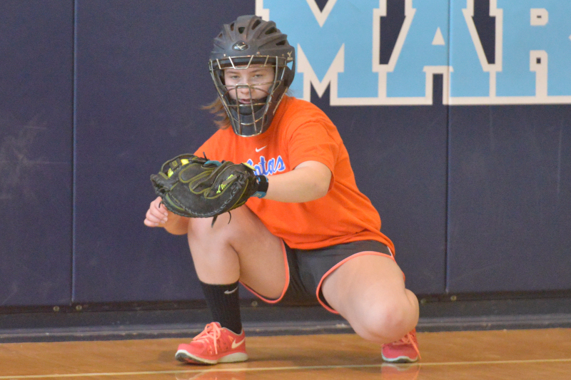 Oceanside’s Ari Curtis frames the ball during pitchers and catchers workout at Oceanside East Thursday. Curtis, one of the leagues stronger catchers should be a huge part of the Mariner lineup as long as she stays healthy. (Photo by Ron Hawkes)