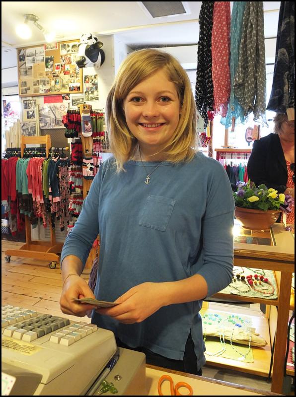 Grand daughter Yelena Randall had to use a stool to reach the cash register when she started working at the store. Years of growth have made the job easier.